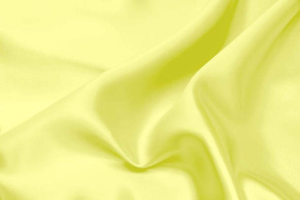 Tissu satiné jaune texture fond flou doux - Photo, image