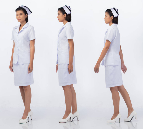 Longueur totale du corps Figure snap de 20s Asiatique Femme porter infirmière blanc uniforme pantalon jupe et chaussures, blanc fond isolé - Photo, image