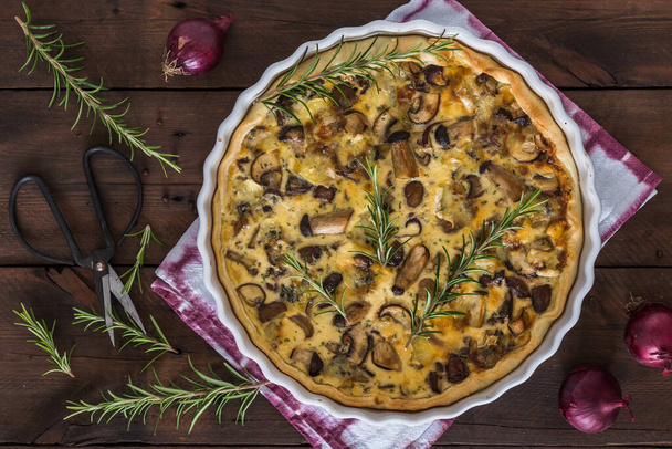 Mushroom tart with red onions and rosemary on wooden table, top view - Photo, Image
