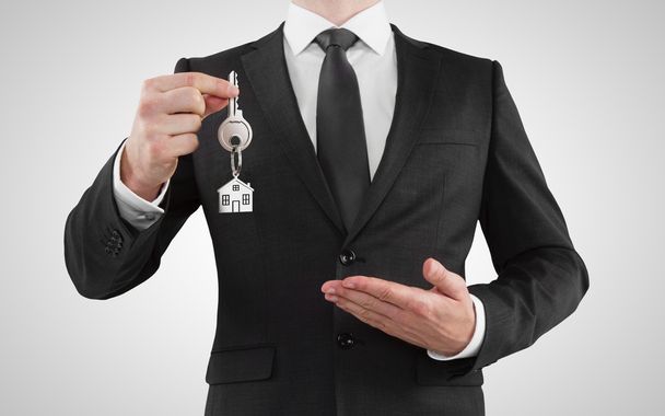 businessman  giving a key - Φωτογραφία, εικόνα