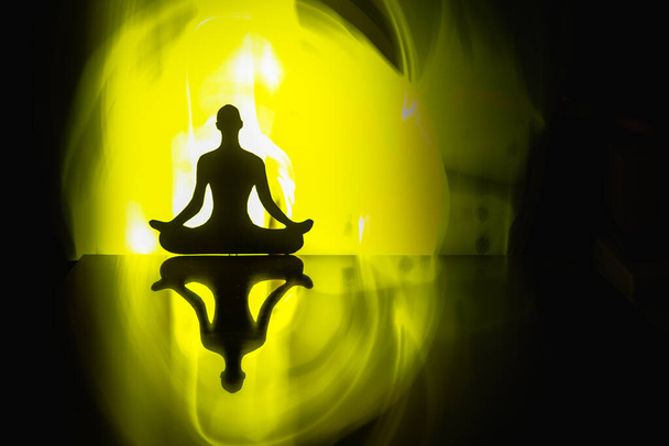 Contour of a man sitting in a lotus position - Photo, Image