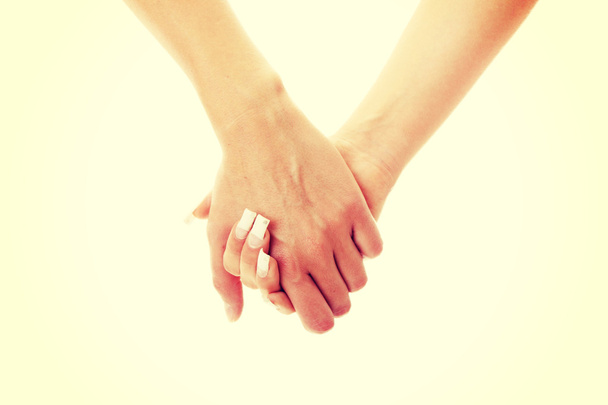 Two woman holding hands - Zdjęcie, obraz