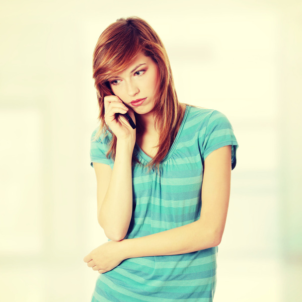 Woman getting bad news by phone - Foto, immagini