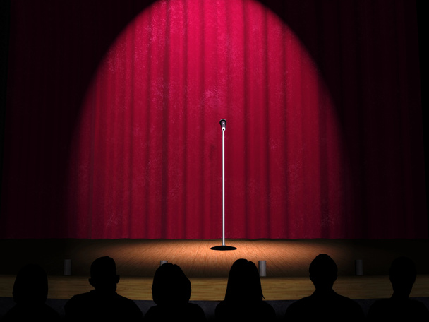 een microfoon op een podium - Foto, afbeelding