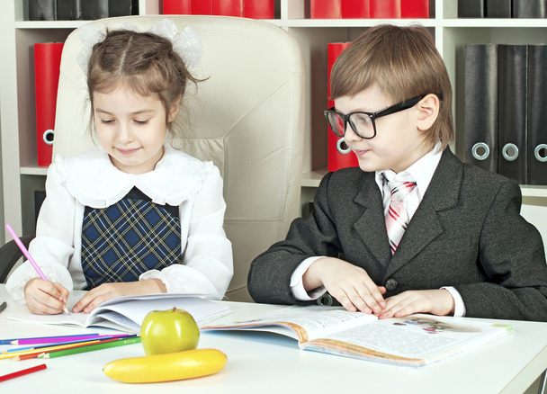 boy and girl children indulge in school - Photo, image