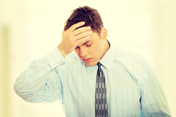 Businessman with headache - Foto, afbeelding
