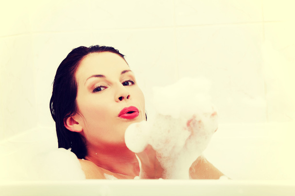 Woman relaxing during the bath. - Φωτογραφία, εικόνα