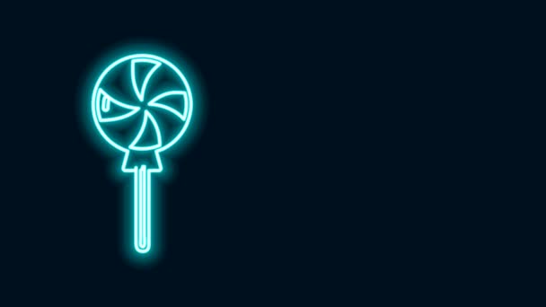 Świecąca neonowa ikona lizaka odizolowana na czarnym tle. Znak słodyczy. Jedzenie, pyszny symbol. 4K Animacja graficzna ruchu wideo - Materiał filmowy, wideo