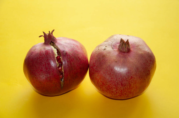 Red ripe pomegranate fruits. Natural pomegranate closeup - Photo, Image