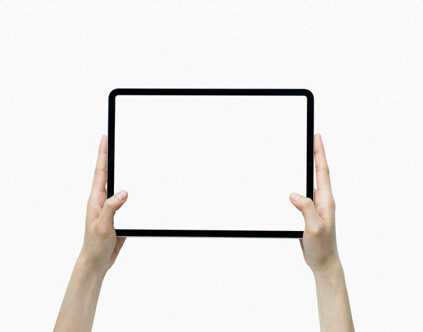 Close-up of hand holding black tablet isolated on white background. - Foto, imagen