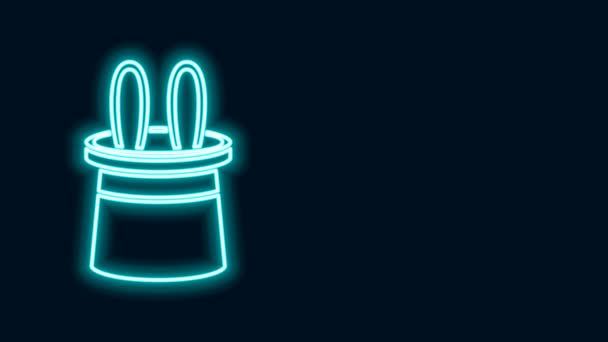 Leuchtende Neon-Linie Magierhut und Hasenohren Symbol isoliert auf schwarzem Hintergrund. Zaubertrick. Mysteriöses Unterhaltungskonzept. 4K Video Motion Grafik Animation - Filmmaterial, Video