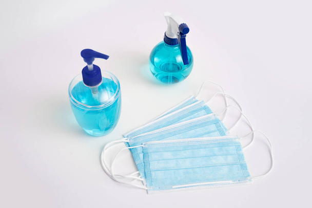 Coronavirus corona virus prevention travel surgical masks and hand sanitizer gel for hand hygiene spread protection. - Zdjęcie, obraz