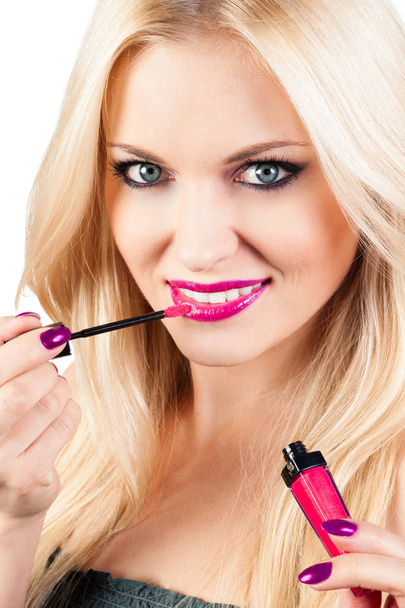 Woman applying lipstick - Foto, Imagem
