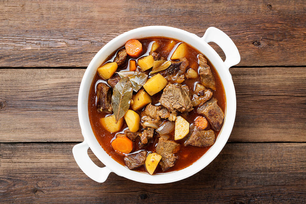 Beef meat stewed with potatoes, carrots and spices (hungarian goulash). - Photo, Image