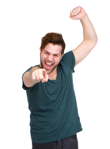 Cheerful young man pointing finger - Φωτογραφία, εικόνα