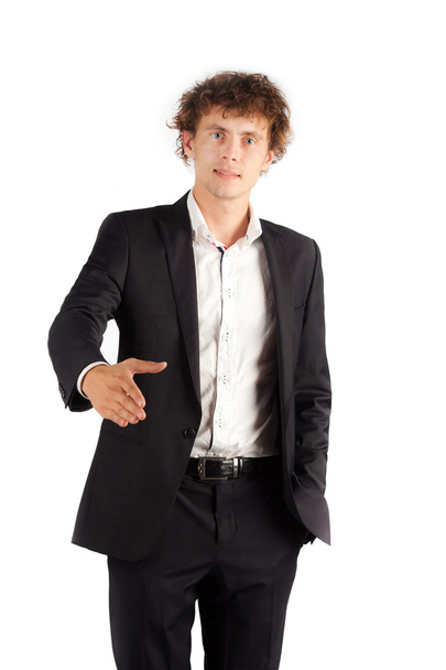 young curly Man standing On white Background and hold hand welco - Фото, зображення