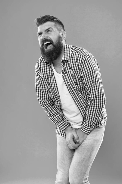 Kicked in the balls. Testicular Blow. Guy got hit in the crotch. Guy folds himself while trying to deal with the pain. Sharp pain that incapacitates your whole body. Bearded man suffering. Attacked - Foto, Bild