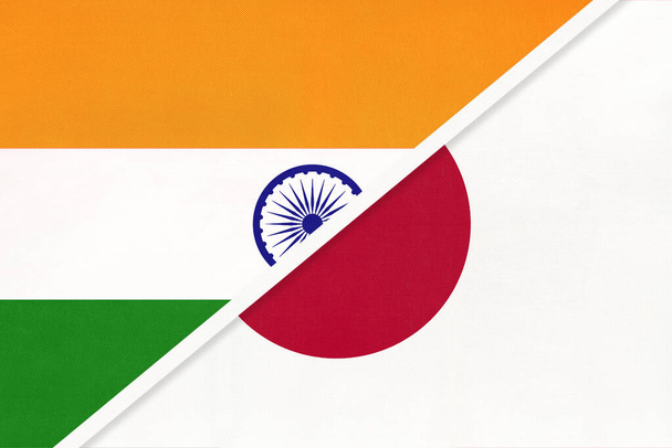 Индия и Япония, символ национальных флагов из текстиля. Отношения, партнерство и чемпионат Азии. - Фото, изображение