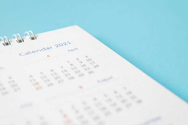 2021 calendar page on blue background business planning appointment meeting concept - Fotó, kép
