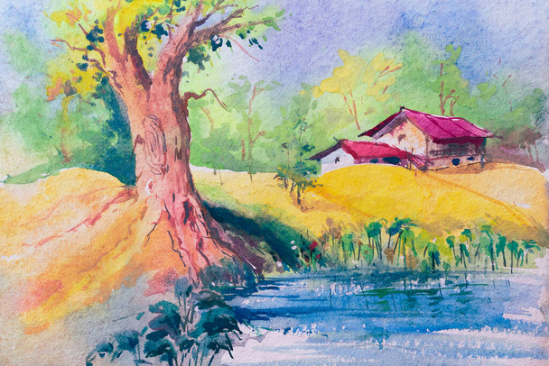Pintura aquarela colorida da aldeia indiana rural. Duas casas, uma grande árvore ao lado de uma lagoa com céu azul no fundo. Aquarela indiana pintada à mão por pincel e cor sobre papel - Foto, Imagem