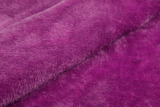 pink Karakul Abstract Artificial texture fur fabric, background, closeup. Fluffy material backdrop, kids toys faux fur. - Photo, Image