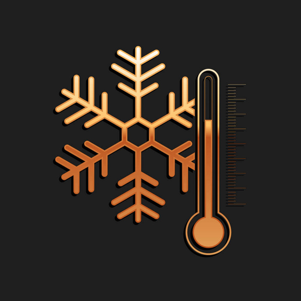Gold-Thermometer mit Schneeflockensymbol isoliert auf schwarzem Hintergrund. Langer Schatten. Vektor. - Vektor, Bild