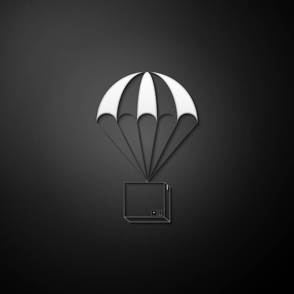 Caixa de prata voando no ícone de paraquedas isolado no fundo preto. Pacote com paraquedas para envio. Serviço de entrega, conceito de transporte aéreo, bônus. Estilo de sombra longo. Vetor. - Vetor, Imagem