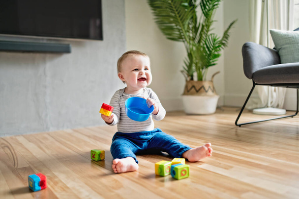 Kids play with toy on the living room - Photo, image
