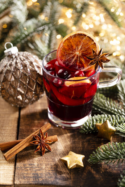 Christmas mulled wine with spices on a wooden rustic table. - Foto, imagen