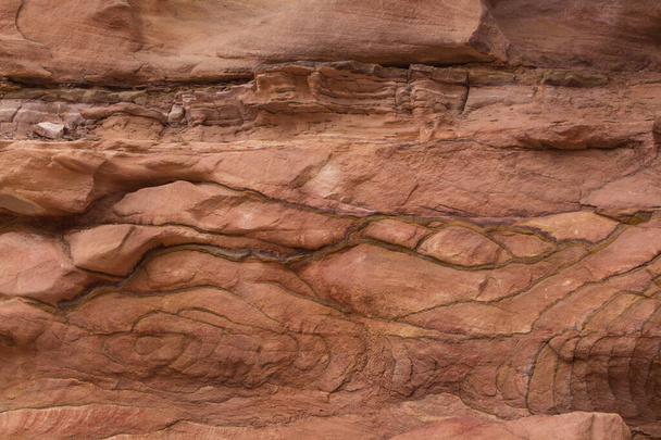 Natural texture of red rocks. Colored canyon, Egypt, desert, the Sinai Peninsula, Nuweiba, Dahab. - Foto, Bild