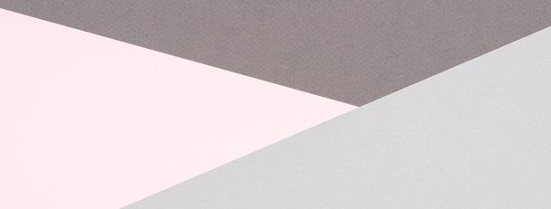 Abstraktní barevné papírové textury pozadí. Minimální geometrické tvary a linie v pastelově růžové a světle šedé barvě - Fotografie, Obrázek