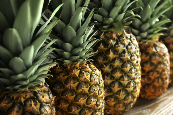 Closeup view of fresh ripe juicy pineapples - Fotoğraf, Görsel