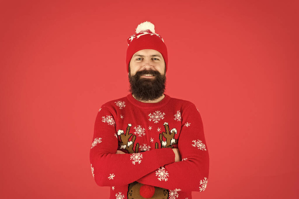 Winter bucket list. Hipster bearded man wear winter sweater and hat red background. Happy new year concept. Join holiday party. Christmas Sweater Party. Winter outfit. Good vibes. Fashion shop - Foto, imagen