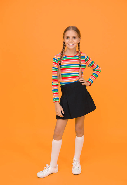 Positivity concept. Happiness. Emotional kid. Fashion shop. Must have accessory. Modern fashion. Kid fashion. Girl long hair. Cute child trendy and fancy. Little girl wearing rainbow clothes - Zdjęcie, obraz