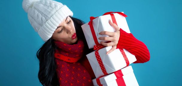Young woman with gift boxes - 写真・画像