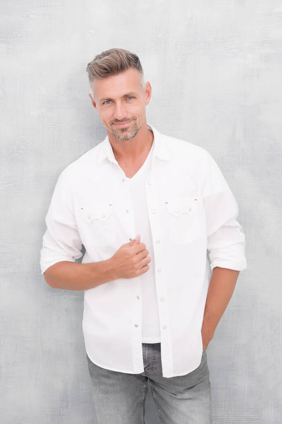 Fashion concept. Man model clothes shop. Mature man model. Feeling comfortable day by day. Menswear and fashionable clothing. Man looks handsome in casual shirt. Guy with bristle wear casual outfit - Photo, image