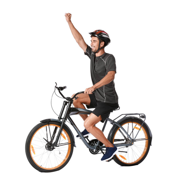 Male cyclist riding bicycle on white background - Foto, Imagem