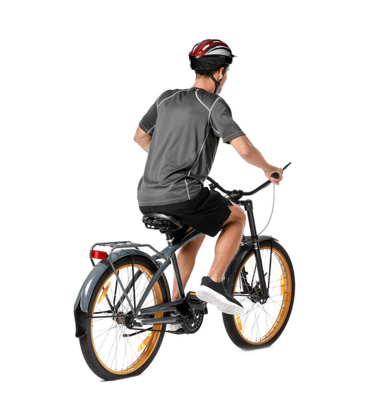 Mężczyzna rowerzysta jazda na rowerze na białym tle - Zdjęcie, obraz