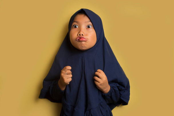 Angry  little cute asian muslim hijab girl  - Photo, Image