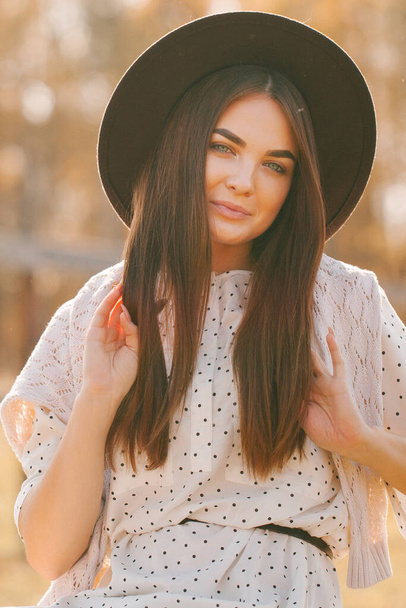 Young beautiful model in a hat on a farm - Fotografie, Obrázek