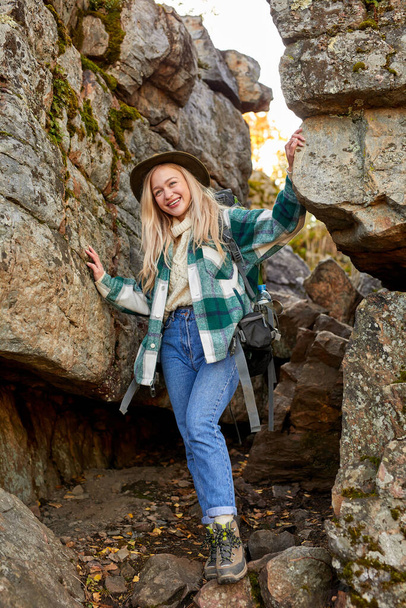 beautiful caucasian blonde female is travelling alone on mountains - Foto, immagini
