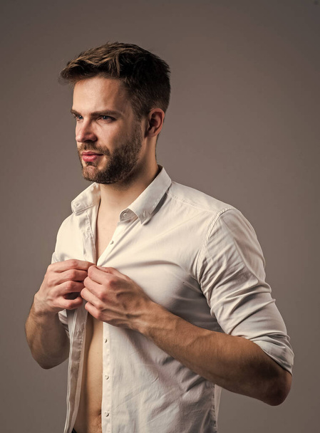 Sexy handsome male. sexy guy looking. portrait of fashionable handsome man in shirt. business classic mens shirts with white print. handsome confident young man standing in shirt - Fotografie, Obrázek