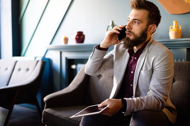 Unhappy businessman on the phone receiving bad news. Business, stress work concept - Photo, Image