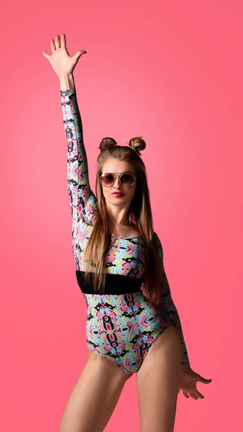 woman posing with raised one hand up on pink background - Foto, immagini