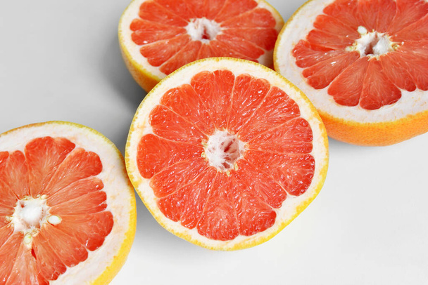 Fresh red grapefruits on white background - Photo, image