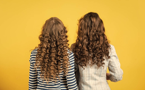 good shampoo or lotion. hairdresser beauty salon. Strong and healthy hair concept. Small children long hair. kidding around. happy girls with long windy hair. healthy and strong hair - Photo, image