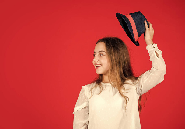 Protect scalp sun rays. Fancy girl. Spring outfit. Individual style. Girl wear hat red background. Happy kid in hat. Fashion accessory. Summer accessory collection. Child wear hat. Accessories shop - 写真・画像