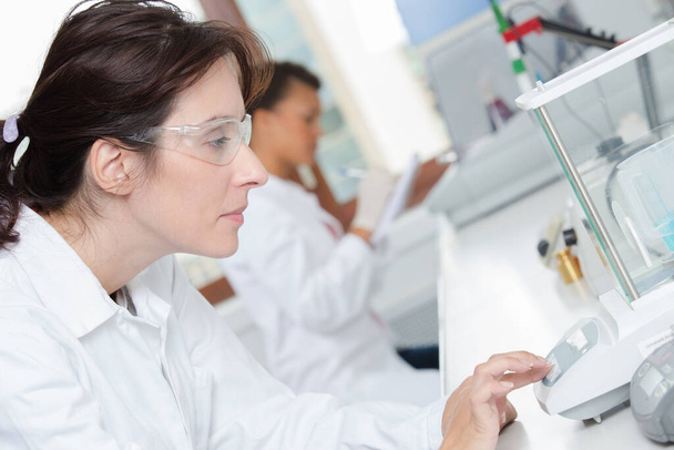 female researcher in a laboratory - Фото, зображення
