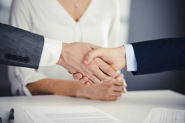 Business people shaking hands finishing contract signing, close-up. Business communication concept. Handshake and marketing - Foto, imagen