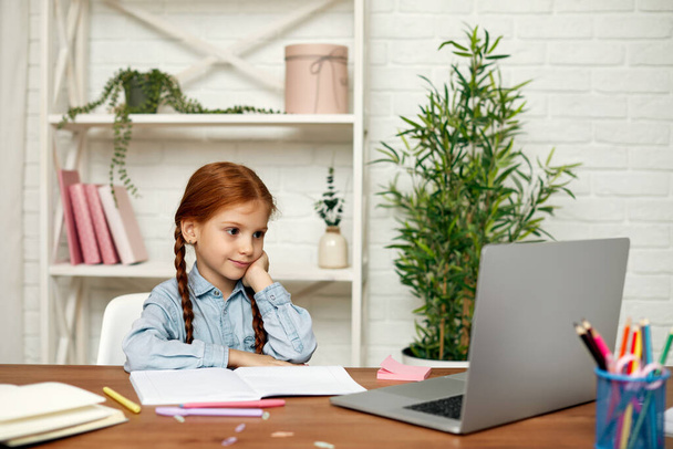 little child girl using laptop for studying online - Zdjęcie, obraz